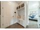 Mudroom with coat rack and bench, plus view into bedroom at 515 Lizzie Ln, Fort Mill, SC 29708