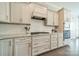 Kitchen features white cabinets, granite countertops, subway tile and stainless appliances at 515 Lizzie Ln, Fort Mill, SC 29708