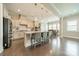 Open concept kitchen featuring stainless appliances, an island and hardwood floors at 515 Lizzie Ln, Fort Mill, SC 29708