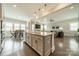 Open concept kitchen and dining room featuring stainless appliances, an island and hardwood floors at 515 Lizzie Ln, Fort Mill, SC 29708