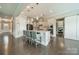Open concept kitchen featuring stainless appliances, an island and hardwood floors at 515 Lizzie Ln, Fort Mill, SC 29708