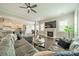 Open concept living room with hardwood floors, recessed lighting, fireplace, and neutral paint at 515 Lizzie Ln, Fort Mill, SC 29708
