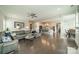 Open-concept living room with hardwood floors, comfortable seating, and a view into the kitchen at 515 Lizzie Ln, Fort Mill, SC 29708