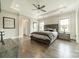 Spacious main bedroom with hardwood floors, tray ceiling and a ceiling fan at 515 Lizzie Ln, Fort Mill, SC 29708