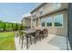 Outdoor patio area featuring a dining set and a gas grill, ideal for outdoor entertaining and relaxation at 515 Lizzie Ln, Fort Mill, SC 29708