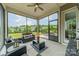 Relaxing screened-in porch with cozy seating and views of the backyard at 515 Lizzie Ln, Fort Mill, SC 29708