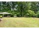 Expansive backyard featuring a gazebo and mature trees, perfect for outdoor enjoyment at 52 September Ct, Concord, NC 28025