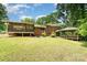 Spacious backyard featuring a screened porch, gazebo, and lush green lawn at 52 September Ct, Concord, NC 28025