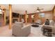 Basement with carpeted floors, paneled walls, and brick fireplace with contemporary living room furniture at 52 September Ct, Concord, NC 28025