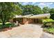 Attached carport offers covered parking and convenience, alongside a well-manicured yard and inviting curb appeal at 52 September Ct, Concord, NC 28025
