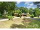 Spacious home with ample green space, featuring a long driveway and mature trees for added privacy at 52 September Ct, Concord, NC 28025