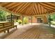 Wooden gazebo featuring outdoor seating and a view of the home's backyard and patio area at 52 September Ct, Concord, NC 28025