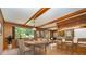 Spacious kitchen and dining area with wood accents, brick-style flooring, and adjacent living space at 52 September Ct, Concord, NC 28025