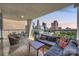 Relax on this condo balcony with a city view, complete with stylish seating and dining set at 520 E Martin Luther King Jr Blvd # 1002, Charlotte, NC 28202