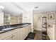 Elegant bathroom with double vanity, large mirrors, and decorative accents at 520 E Martin Luther King Jr Blvd # 1002, Charlotte, NC 28202