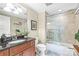 This is a bathroom with stylish fixtures, tiled shower, and granite counters at 520 E Martin Luther King Jr Blvd # 1002, Charlotte, NC 28202