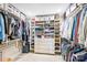 Walk-in closet with custom shelving, drawers, and ample storage space at 520 E Martin Luther King Jr Blvd # 1002, Charlotte, NC 28202