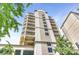 Exterior shot of a high-rise condo building showcasing modern architecture against a bright blue sky at 520 E Martin Luther King Jr Blvd # 1002, Charlotte, NC 28202