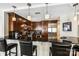 Modern kitchen featuring stainless steel appliances, dark wood cabinets and a breakfast bar at 520 E Martin Luther King Jr Blvd # 1002, Charlotte, NC 28202