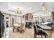 Dining area featuring a table for six, chandelier, and wet bar with seating at 520 E Martin Luther King Jr Blvd # 1002, Charlotte, NC 28202