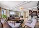 Open floor plan boasting an ample living room area with a view to the outdoor deck at 520 E Martin Luther King Jr Blvd # 1002, Charlotte, NC 28202
