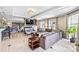 Bright living room with tile floors, a fireplace, a TV and lots of natural light at 520 E Martin Luther King Jr Blvd # 1002, Charlotte, NC 28202