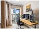 Office space with bamboo desk and balcony access showcasing city views at 520 E Martin Luther King Jr Blvd # 1002, Charlotte, NC 28202
