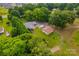 Overhead view of the home showing the lush lawn, brick home, and detached garage at 648 Odell School Rd, Concord, NC 28027
