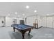 Spacious basement features a pool table for entertainment at 648 Odell School Rd, Concord, NC 28027
