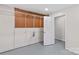 Unfinished basement space with shelving and doorway at 648 Odell School Rd, Concord, NC 28027