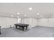 Spacious basement features a pool table for entertainment at 648 Odell School Rd, Concord, NC 28027