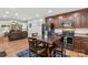 Kitchen and living room featuring a dark cabinet, stainless appliances, and hardwood floors at 648 Odell School Rd, Concord, NC 28027