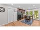 Eat in kitchen with brown cabinets, stainless steel appliances and hardwood floors at 648 Odell School Rd, Concord, NC 28027