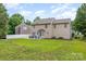 Backyard featuring green grass, outdoor seating and detached garage at 6608 Pattonsburg Dr, Charlotte, NC 28213