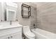 Modern bathroom with a tub and shower combination, sleek vanity, and stylish tiling at 6608 Pattonsburg Dr, Charlotte, NC 28213