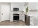 Bright kitchen featuring white cabinets, stainless steel appliances, and a stylish backsplash at 6608 Pattonsburg Dr, Charlotte, NC 28213