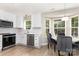 Bright kitchen features white cabinets, stainless steel appliances, and a cozy breakfast nook with natural light at 6608 Pattonsburg Dr, Charlotte, NC 28213