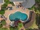 Aerial view of a private backyard oasis featuring a custom pool with a waterfall and lots of room to entertain at 6742 Charlotte Hwy, York, SC 29745