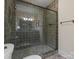 Bathroom with tiled shower, glass door, toilet and bronze fixtures at 6742 Charlotte Hwy, York, SC 29745