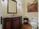Charming powder room with elegant vanity, decorative mirror and wainscoting at 6742 Charlotte Hwy, York, SC 29745