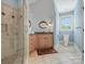 Bathroom featuring neutral tiling, a glass shower, and a light wood vanity with granite countertops at 6742 Charlotte Hwy, York, SC 29745