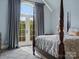 Bedroom featuring french doors, 4 poster bed, and sitting area at 6742 Charlotte Hwy, York, SC 29745