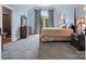 Bedroom featuring a four-poster bed, a vaulted ceiling, and an ensuite bath at 6742 Charlotte Hwy, York, SC 29745