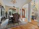 Formal dining room with chandelier, detailed trim and staircase view at 6742 Charlotte Hwy, York, SC 29745