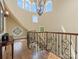 Grand foyer with staircase, chandelier, hardwood floors, and detailed railings at 6742 Charlotte Hwy, York, SC 29745