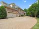 Spacious three car garage with expansive driveway and elegant brick exterior at 6742 Charlotte Hwy, York, SC 29745