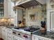 Close up on gourmet stove with tile backsplash in a chef's kitchen at 6742 Charlotte Hwy, York, SC 29745