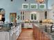 Spacious kitchen with custom cabinets, granite countertops, and a large center island with a prep sink at 6742 Charlotte Hwy, York, SC 29745