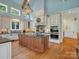 Gourmet kitchen with stainless appliances, custom cabinets and large center island with granite countertops at 6742 Charlotte Hwy, York, SC 29745