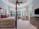 Tranquil main bedroom with tray ceilings, plantation shutters, and a sitting area by the bay windows at 6742 Charlotte Hwy, York, SC 29745